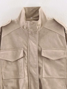 Detailed view of khaki faux suede utility jacket showing stand collar and cargo pockets