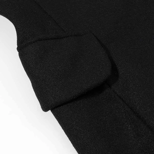 Detail of pocket flap and precision stitching on black heavy wool commuter coat