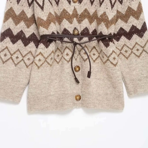 Vintage jacquard knit cardigan with V-neck, retro patterns and waist belt tie detail