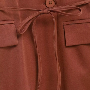Caramel brown waist-tie blazer with matching resin button and flap pockets detail
