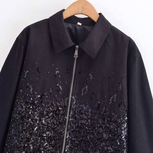 Women's black zip-up jacket with shimmering sequin embellishments on premium fabric