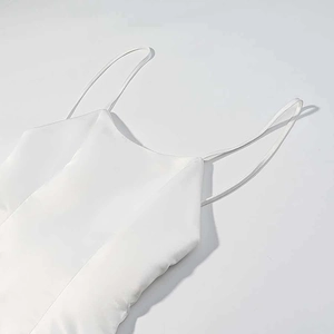 Elegant white satin dress with delicate feather trim and adjustable spaghetti straps