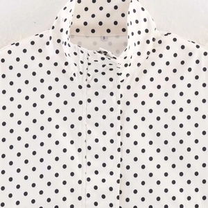 Casual white polka dot zip-up jacket for women featuring a stand collar and drawstring hem