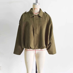 Olive green faux suede bomber jacket with shoulder epaulettes and oversized silhouette