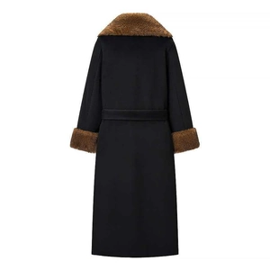 Women black wool coat with brown faux fur collar and waist belt for a slim winter look