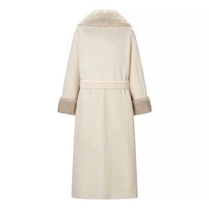 Back view of cream wool coat featuring plush faux fur collar, cuffs and waist tie belt