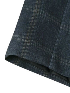 Detailed close-up showing the premium plaid fabric texture and inner lining of the blazer