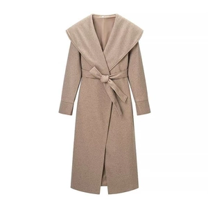 Elegant camel wool coat with large shawl collar and belted waist in minimalist style