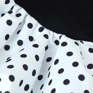 Women's sexy V-neck sleeveless dress featuring black and white polka dot patchwork detail