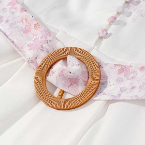 Pink floral white long sleeve dress with woven buckle belt and fabric buttons
