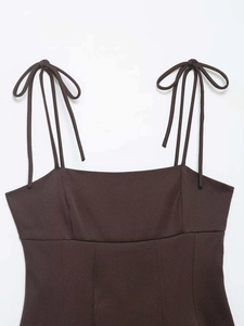 Detail of coffee brown elastic top with slim straps and bow tie design