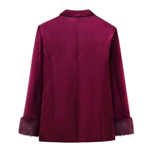 Back view of burgundy velvet blazer with faux fur cuffs and tailored slim fit design