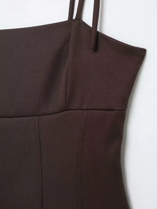 Detail of slim-fit brown camisole showing twill fabric texture and stitching lines