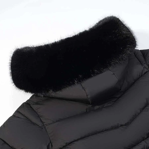 Detail of winter parka with luxury faux fur collar and wave quilted fabric texture