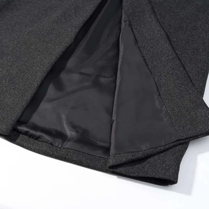 Long dark grey wool blend coat with smooth black lining and meticulous stitching