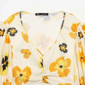 Floral print long sleeve V-neck top with puff sleeves and ruched chest detail