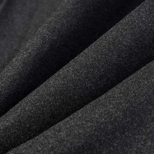 Detailed macro texture of dark grey wool blend fabric showing soft brushed fiber surface