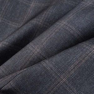 Close-up of grey plaid fabric detail with subtle red stripes and twill texture on blazer