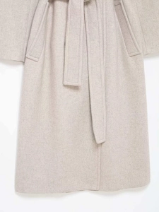 Detail of wool blend coat with double-breasted buttons and matching waist belt
