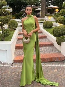 Detail of elegant grass green satin maxi dress showing the long neck tie and scarf feature