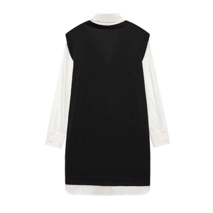 Women's stylish black knit vest layered over a long sleeve white poplin shirt mini dress