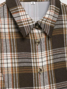 Detail of classic brown plaid shirt showing sharp collar, buttons and M size label