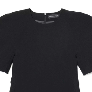 Elegant black puff sleeve dress featuring a round neck and textured fabric finish