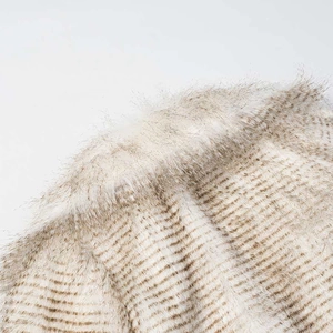 Detailed close-up showing soft long-fiber faux fur texture with apricot leopard pattern