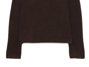Detailed view of the dark brown knitted cardigan cuffs and hem with soft fuzzy texture