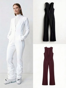 Detail of slim-fit ski jumpsuit with front zipper, zipped pockets and flared hem