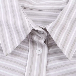 Detail of gray vertical stripes fabric and white buttons on a classic collared shirt