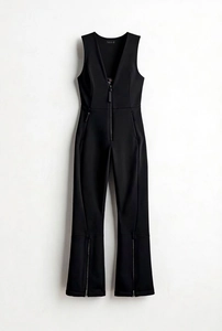 Detail of black slim-fit sleeveless jumpsuit with deep V-neck and front metal zipper