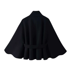 Detail view of women's black cape coat featuring a high collar and wavy pleated hem