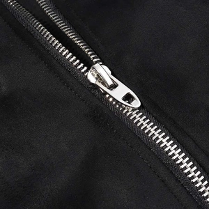 Macro shot of high-quality silver metal zipper on a black winter faux fur jacket