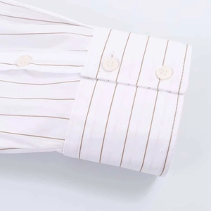Detail of classic double-button cuffs on white and coffee striped cotton blend shirt