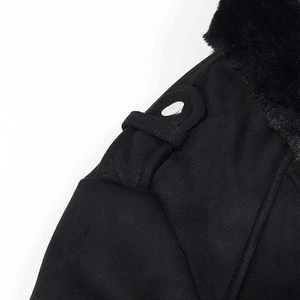 Detail of black faux suede jacket featuring warm faux fur collar and shoulder epaulette