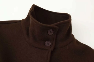 Detail view of coffee brown wool coat showing standing collar and dual button closure