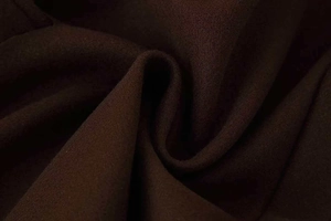 Close-up of the thick dark brown wool blend fabric showing soft woven texture and quality