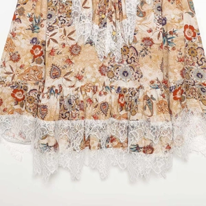 Floral print summer dress with elegant white lace trim and ruffled hem detail