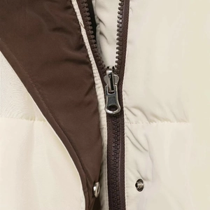 Fashionable reversible hooded jacket in cream and brown with metal zipper and snap buttons