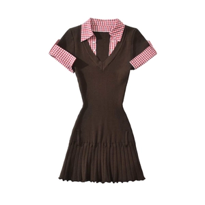 Close-up of knit dress with brown texture, V-neck and red checkered collar details