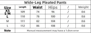 Detailed size chart for women's black wide-leg pleated trousers from size XS to L