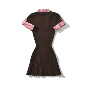 Rear view detail of a pleated knit dress with gingham collar and cuffed sleeves