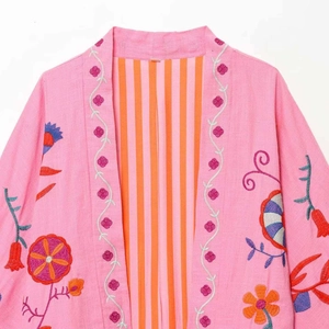 Pink kaftan jacket with bohemian floral embroidery and striped lining detail