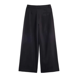 Detail view of the back of black wide-leg trousers featuring a neat welt pocket and belt loops