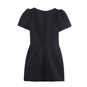 Back view of a black short sleeve dress featuring puff sleeves and a long central zipper