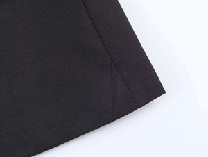 Detail of premium black twill fabric and reinforced stitching on a commuter suit set