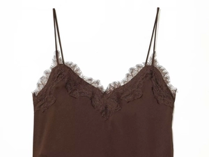 Detail of dark brown camisole with delicate eyelash lace trim and silk texture