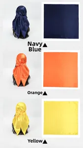 Detail view of smooth satin square scarves in navy blue, orange, and yellow shades