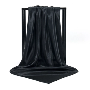 Elegant black satin 90cm square silk scarf displayed on a minimalist metal frame